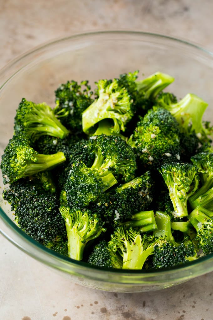 Grilled broccoli is packed with flavor and is a colorful and healthy side dish! #broccoli #bajap Florets tossed with olive oil, garlic and herbs.
