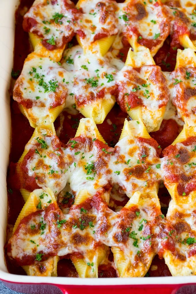 Baked stuffed shells filled with three types of cheese and topped with marinara sauce. #pasta #bajap Baked stuffed shells filled with three types of cheese and topped with marinara sauce.