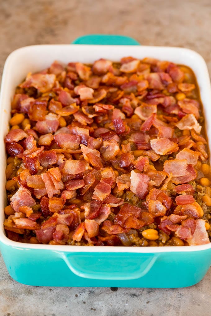 A baking dish ready to go into the oven topped with diced bacon.