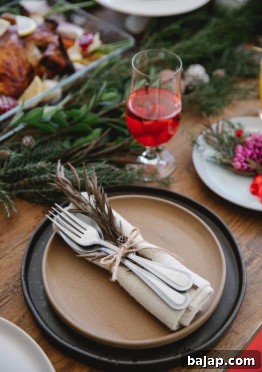 A festive Christmas table adorned with warm, welcoming tones like deep reds, gold accents, and lush greenery, creating a cozy and inviting atmosphere.