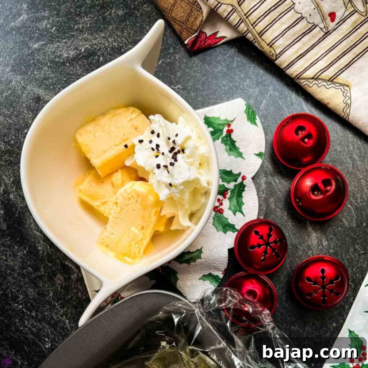 Delicious egg liqueur parfait in white bowl. Garnished with whipped cream and chocolate sprinkles.