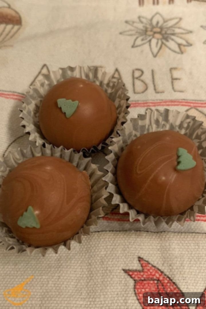 Homemade milk chocolate truffles filled with luxurious salted caramel cream, perfect for gifting or indulging.