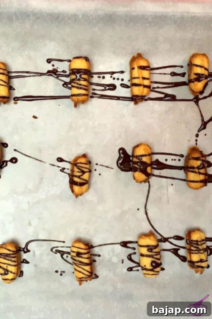 Austrian Spritz cookies, aka Spritzgebäck, filled with a delicious chocolate ganache.