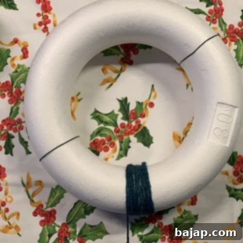 Securing the styrofoam wreath base with florist wire