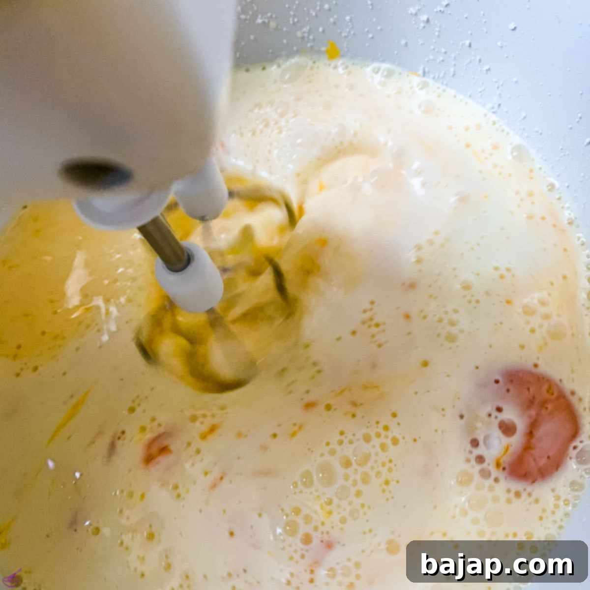 Using an electric mixer, combine all the cream, milk, powdered sugar, yolks, and vanilla sugar until thoroughly blended and smooth.
