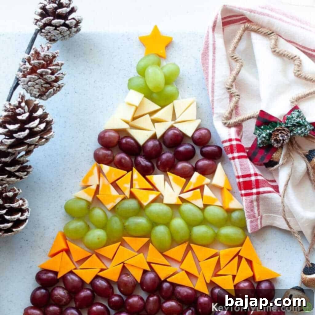 This Christmas tree cheese platter is the perfect no-bake holiday appetizer! It's festive, delicious, and easy for anyone to make. It's a great recipe to make with kids, too!