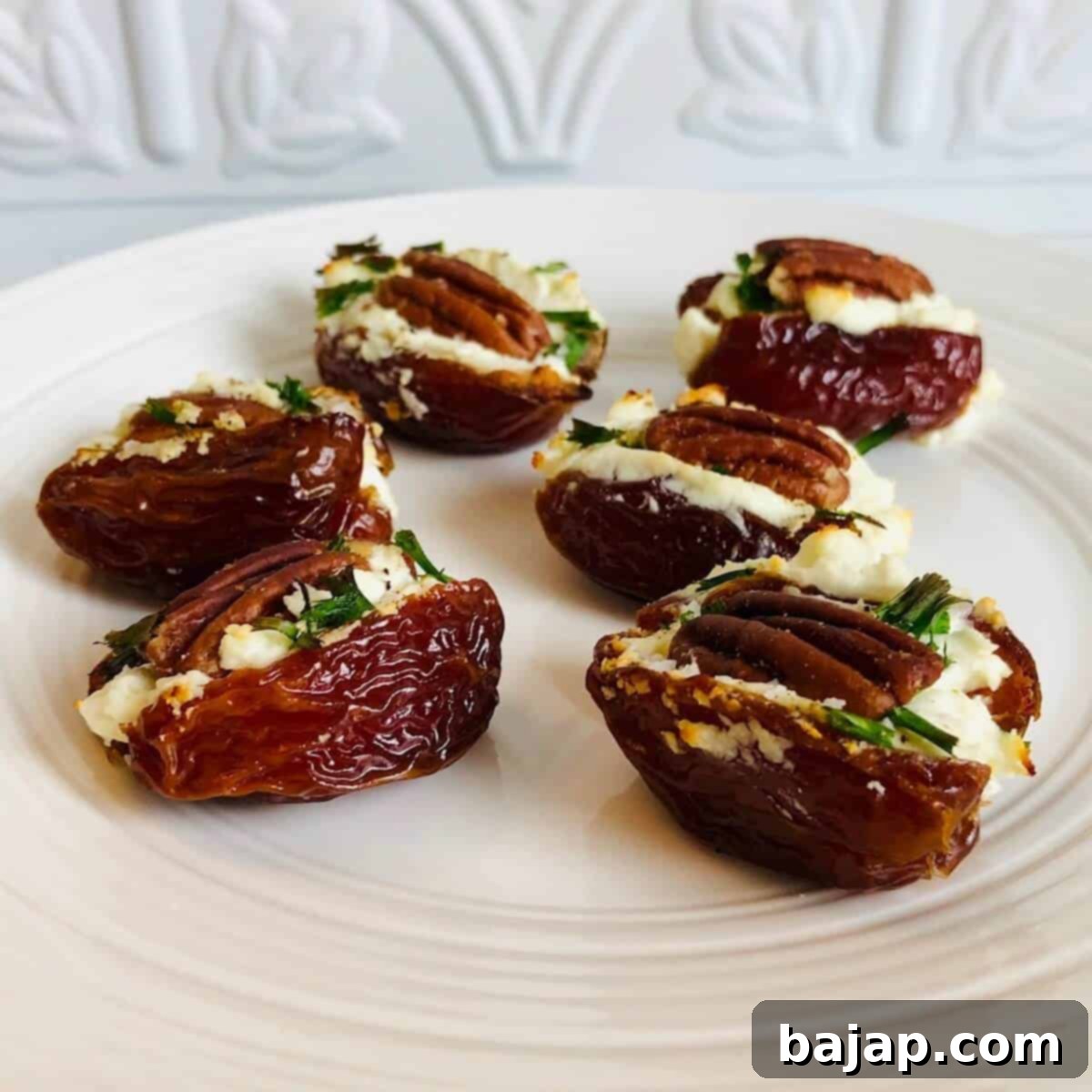 These goat cheese stuffed dates have the perfect balance of sweet and savory flavors. Fresh chives and crunchy pecans complement the richness of the goat cheese and sweetness of the dates. They're easy to make and can be prepared in advance.