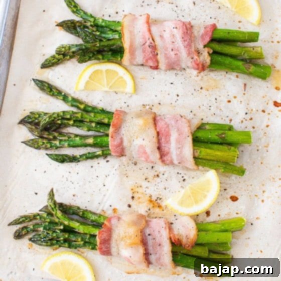 This easy Bacon Wrapped Asparagus bundles are oven roasted in under 30 minutes, until crispy, tender, and juicy. When finished with a drizzle of lemon juice and a sprinkling of salt, these low carb appetizers are irresistible!