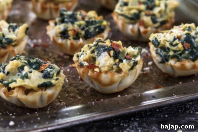 Vegan Spinach Artichoke Cups ~ a crowd favorite tucked inside a crispy and flaky shell.