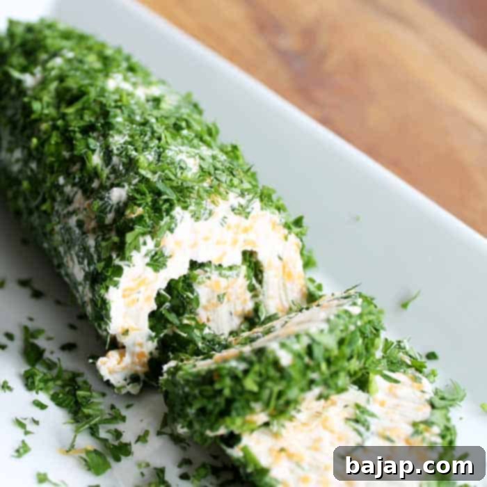 This cheese roll recipe is a twist on the traditional cheese ball. Make this cheese log as an appetizer for your next party!