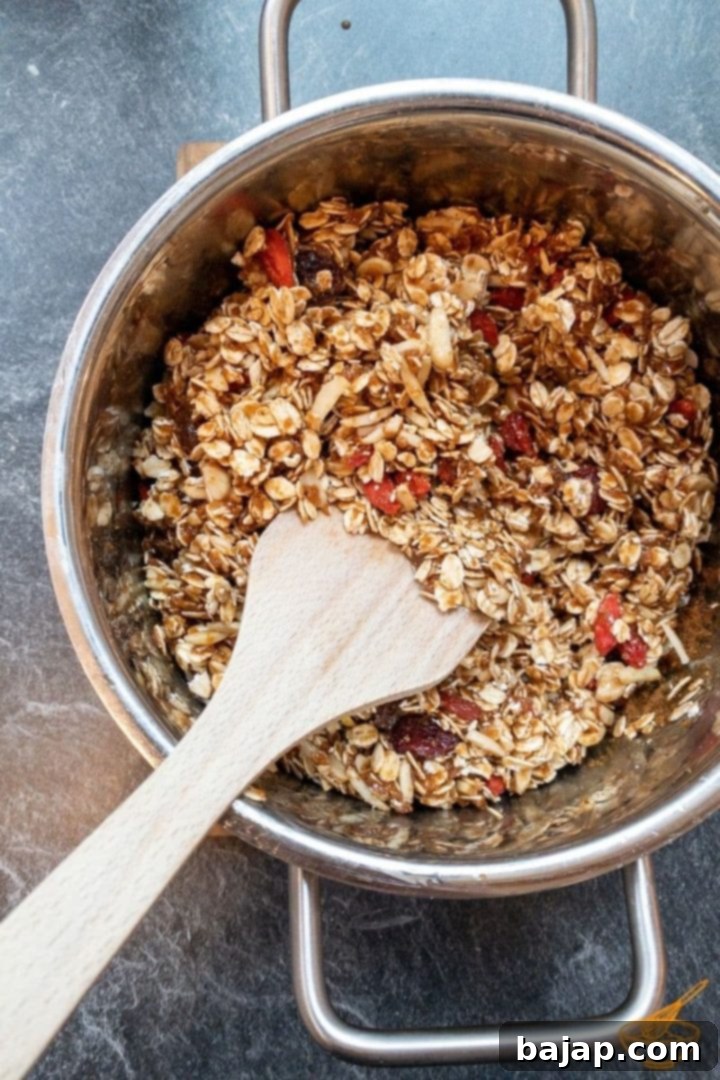 Quick and Easy Biscoff Granola 3 Add all dry ingredients to the liquefied honey.