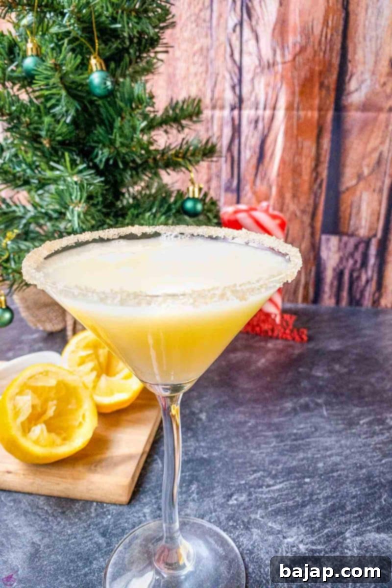 A beautifully presented festive Snowball Cocktail with a sugar rim, ready to be enjoyed during the holidays.