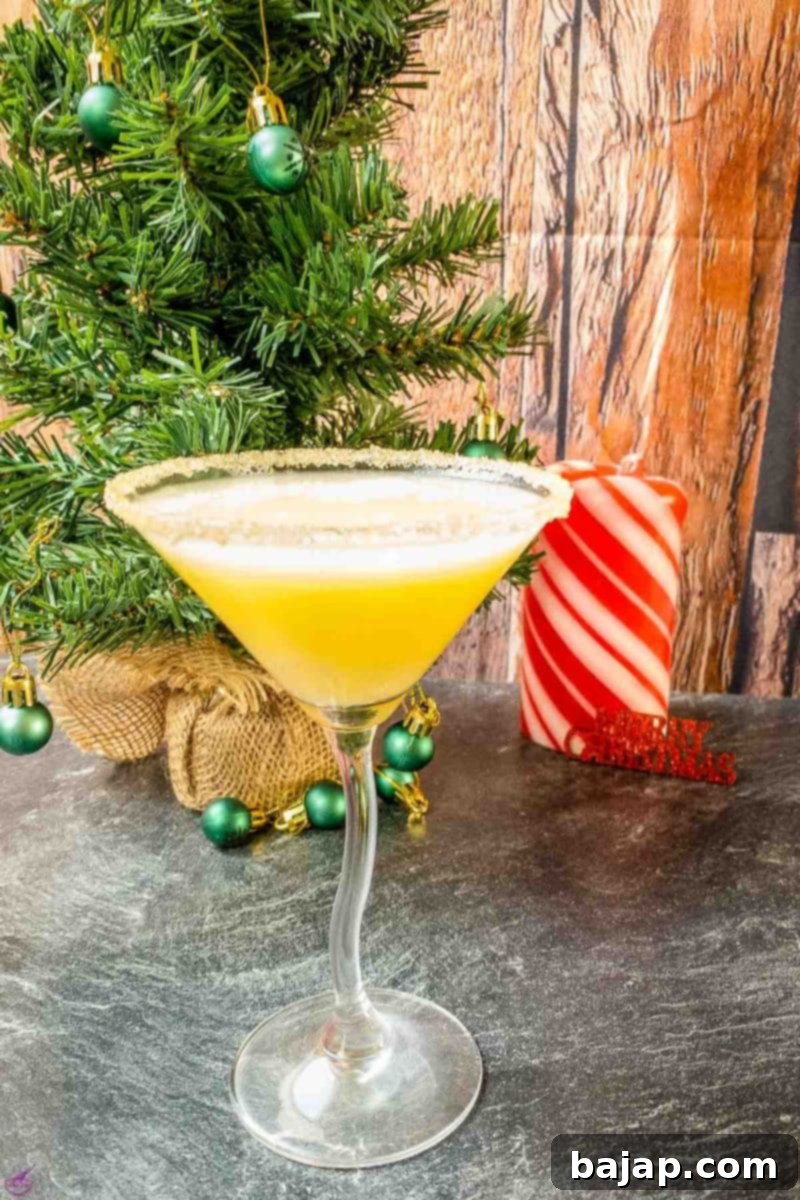 The finished Snowball Cocktail, topped with bitter lemon and garnished, ready to be served and enjoyed.