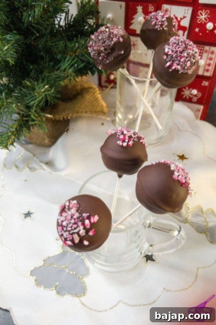 Beautiful and delicious Oreo candy cane cake pops, ready to be served