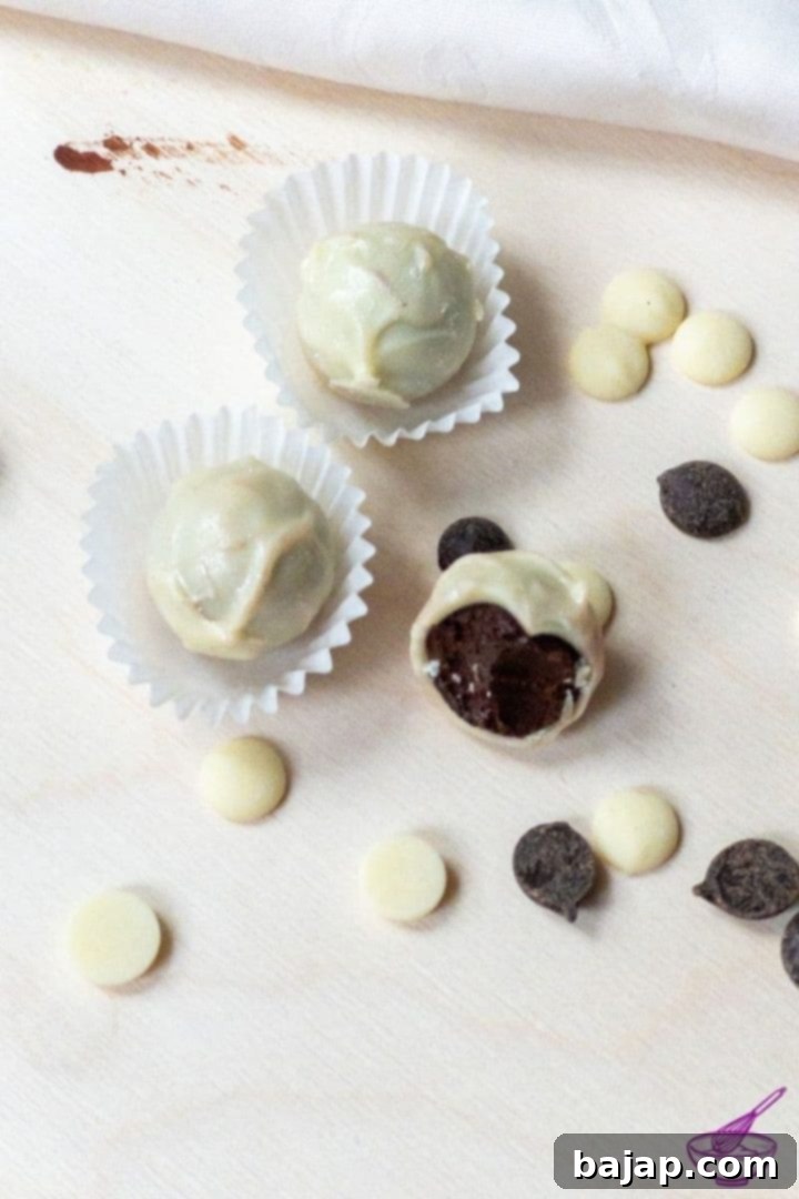 Homemade dark chocolate truffles with white chocolate coating and cinnamon ganache, a fructose-free and gluten-free delight