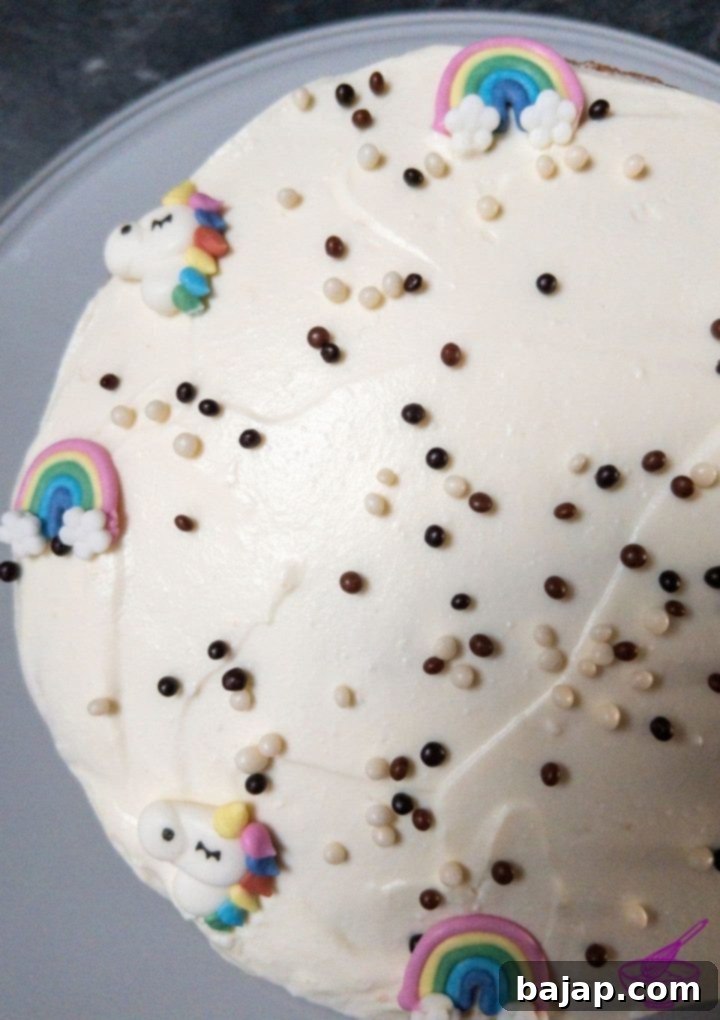 Heavenly Ricotta Vanilla Cream Cake 7 Ricotta Vanilla Cake decorated with sugar unicorns and rainbows.