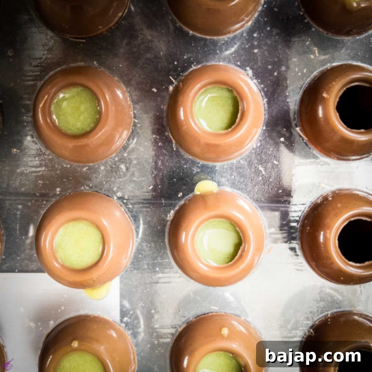 St Patricks Day Emerald Matcha Truffle Delight 7 Filled chocolate hollow spheres waiting to be sealed.
