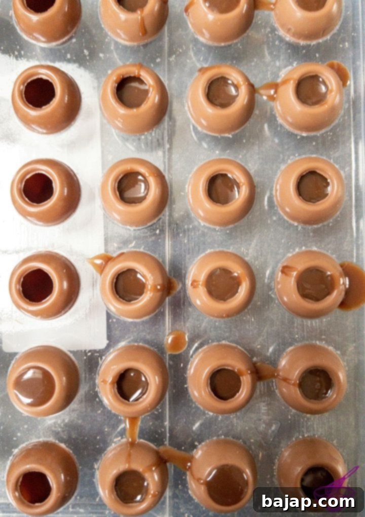 filling the chocolate hollow spheres