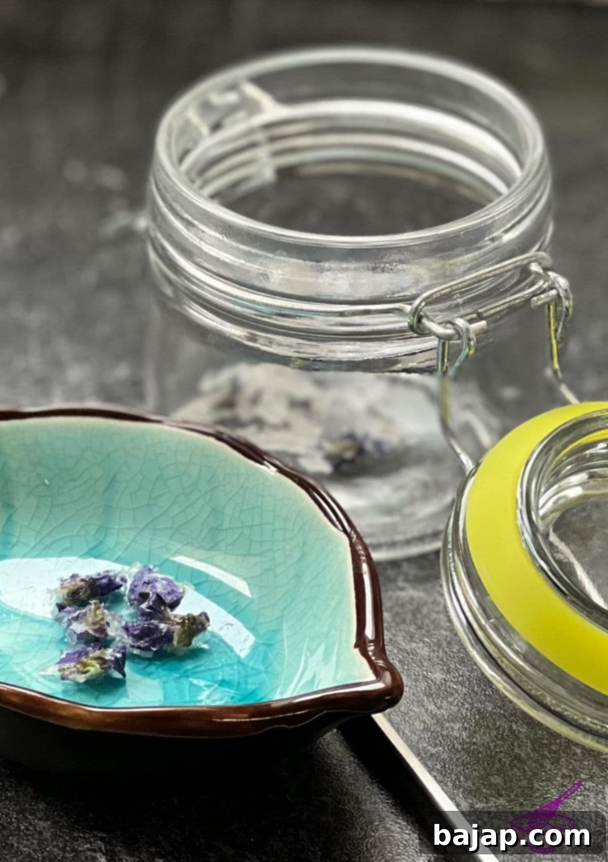 Empress Elisabeth's favorite treat: Candied Violets. A small silver box filled with deep purple candied violets, arranged beautifully.