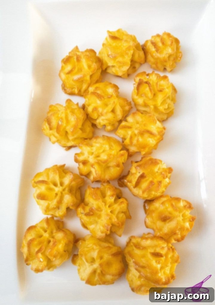 Baked golden-brown Duchess Potatoes, perfectly crisp and ready to serve as a stunning side dish.