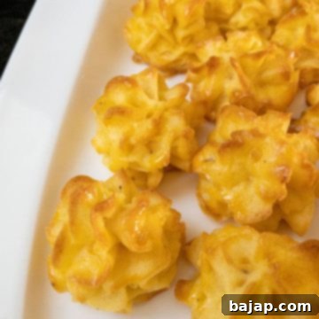 Ready-to-eat golden-brown Duchess Potatoes on a plate, showcasing their festive appearance.