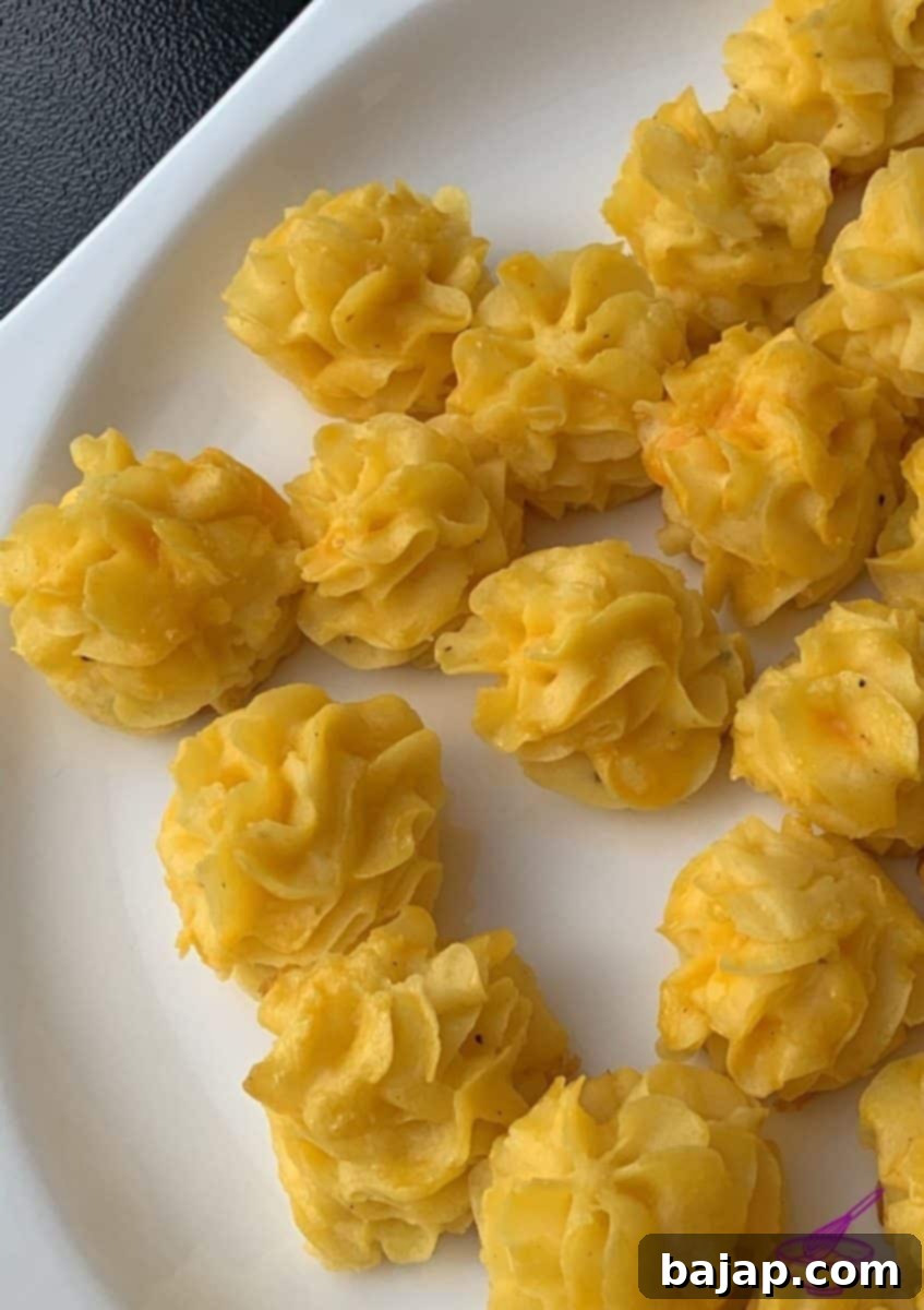 Finished grilled duchess potatoes on a plate