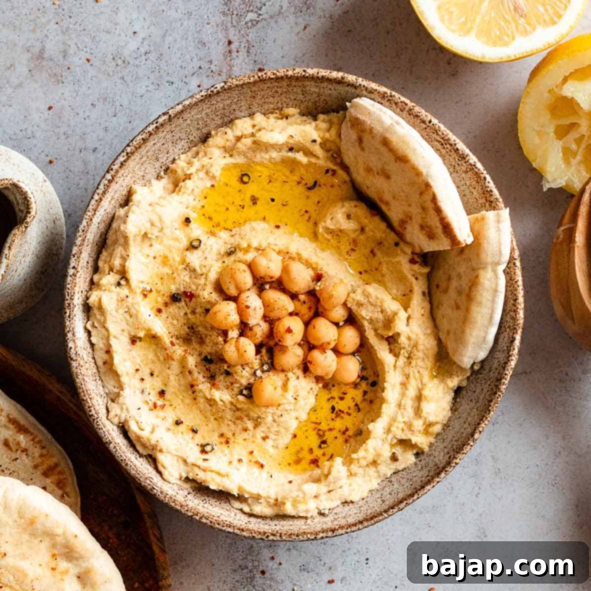 Creamy Hummus without Garlic served in a white bowl.
