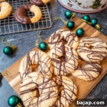 Chocolate drizzled and chocolate dipped butter cookies ready to eat, beautifully arranged.