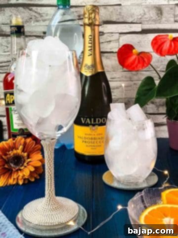 Fill the glasses with cubed ice.