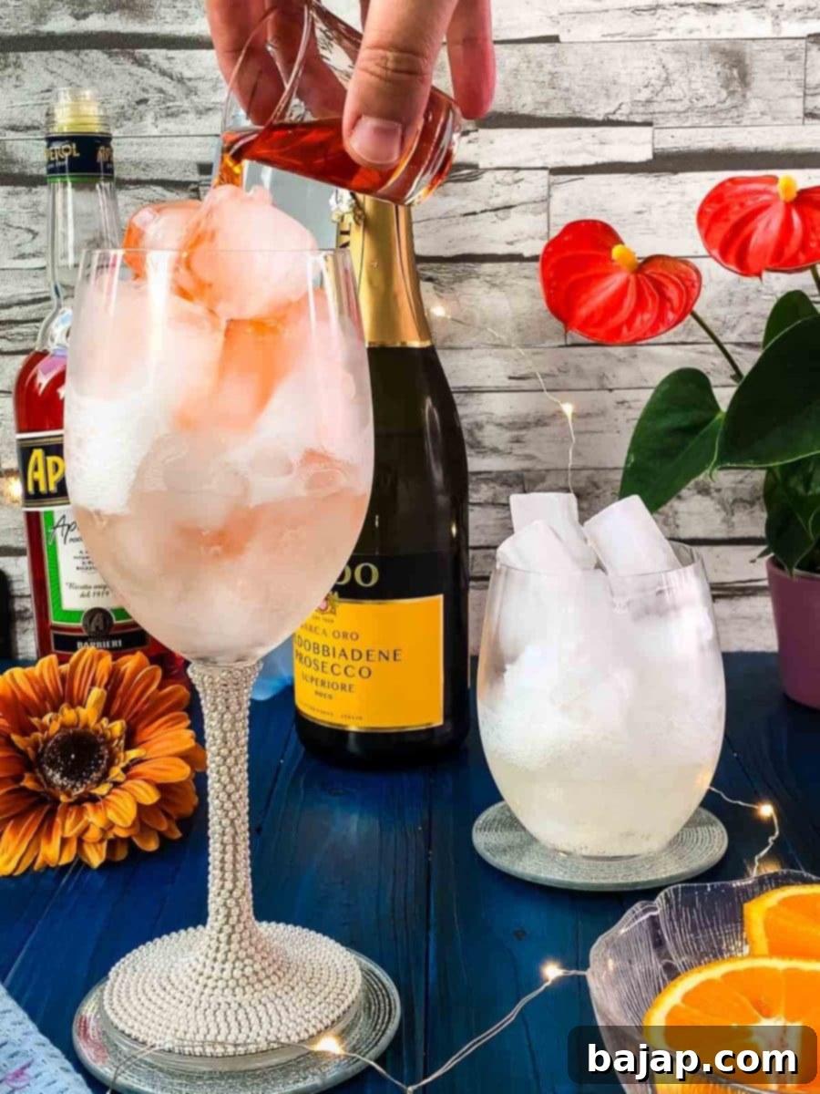 Carefully add 1.5 oz of Aperol to each glass, allowing it to layer beautifully with the Prosecco.