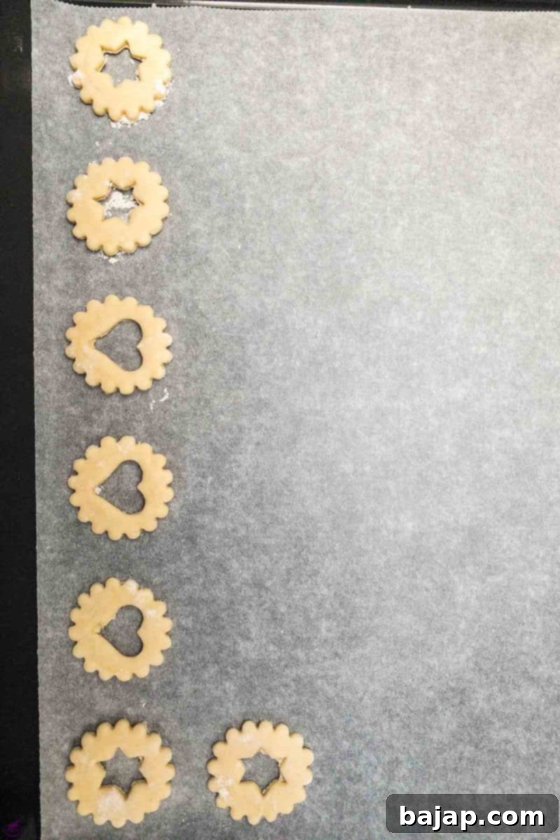 Cut out sour cream cookie dough - placed on a baking sheet lined with parchment paper. 