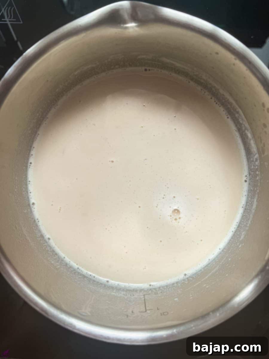 Easy 2 Ingredient Caramel Milk 7 Ready to drink caramel milk in saucepan.