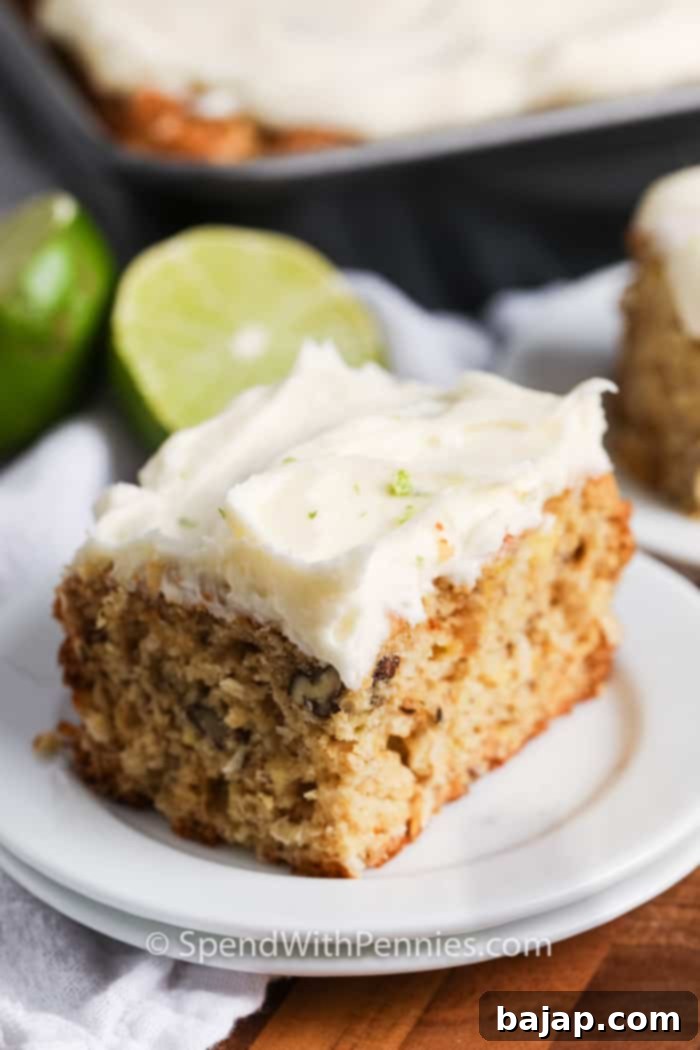 A beautifully frosted pineapple coconut cake, ready to serve.
