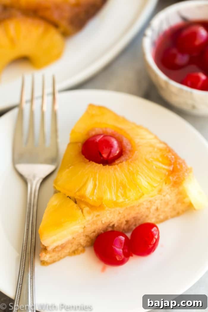 A stunning pineapple upside down cake, fresh from the oven, with a glistening caramel and fruit topping.