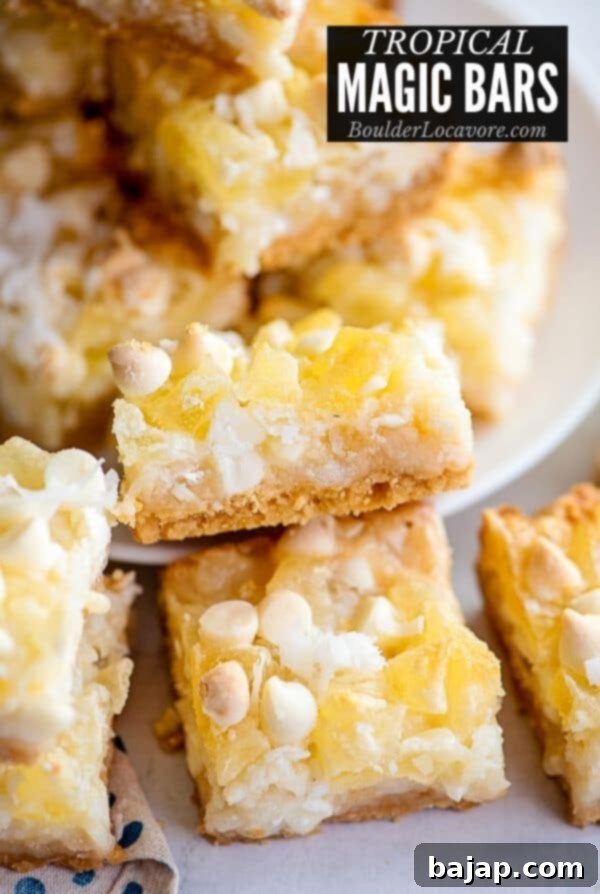 Tropical magic cookie bars with pineapple, coconut, and macadamia nuts.