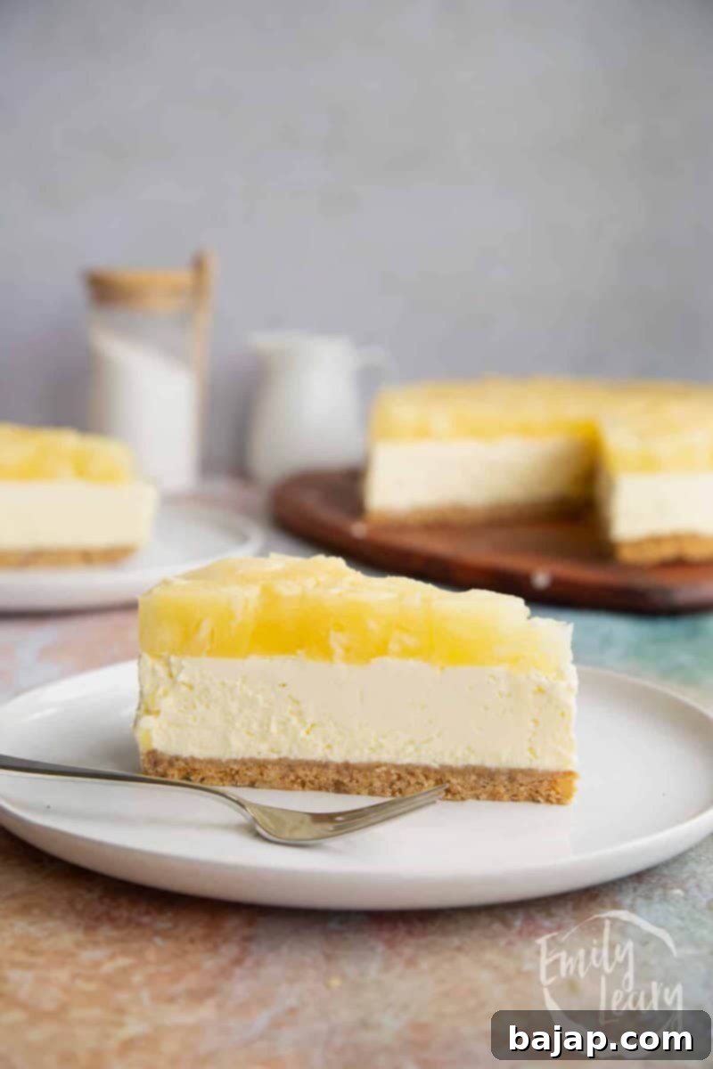 A beautifully set no-bake pineapple cheesecake with a fruity jelly topping.