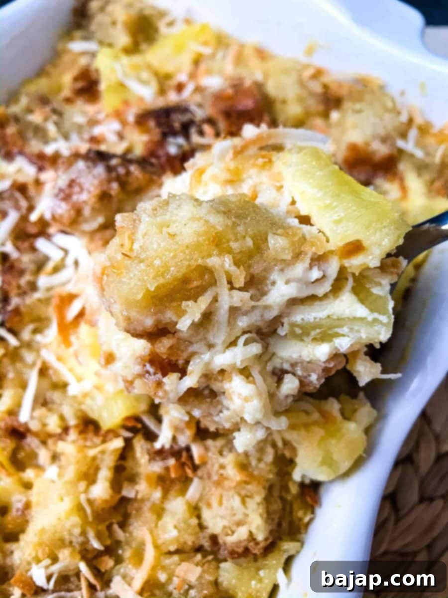 A rich Pina Colada bread pudding, baked golden brown.