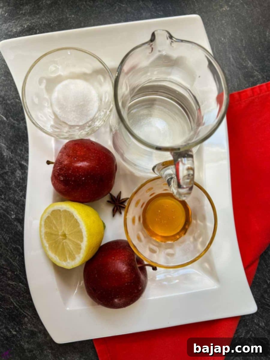 Apple compote ingredients - Fresh apples, sugar, water and a squeeze of lemon. Pepped up with star anise.