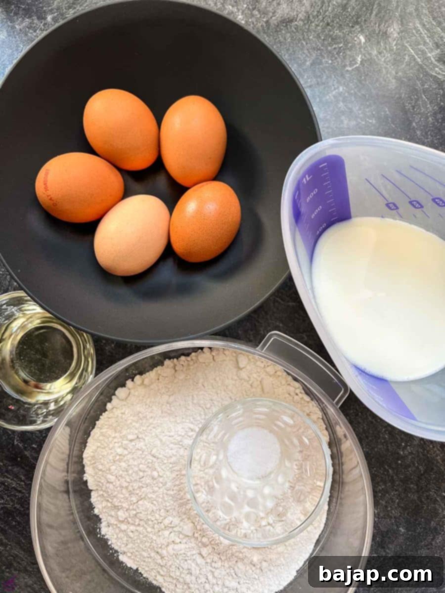 Close-up of Kaiserschmarrn ingredients: fresh eggs, a carton of milk, a bowl of flour, and a stick of butter, arranged neatly for cooking.