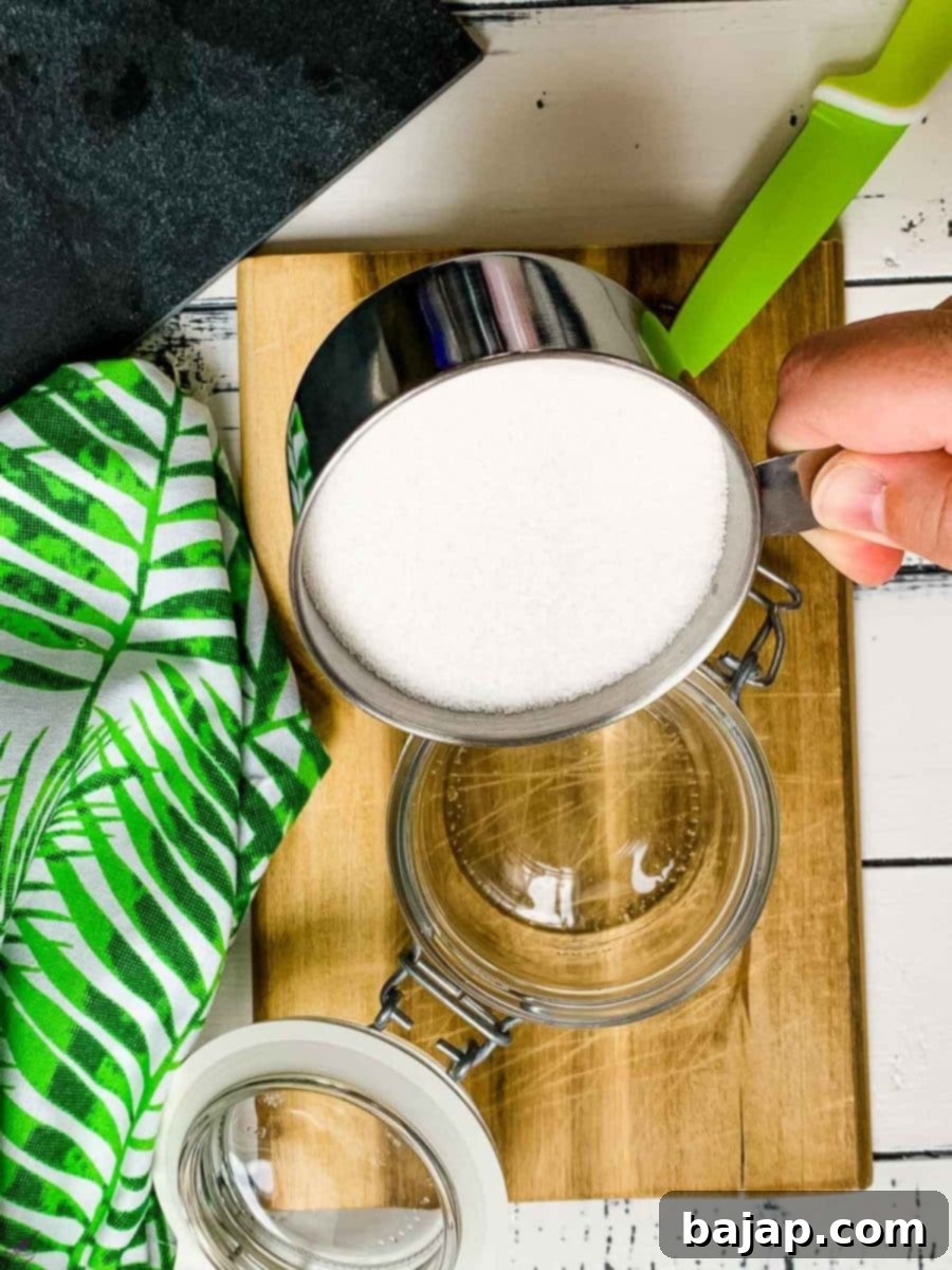 Fill the preserving jar halfway with sugar.