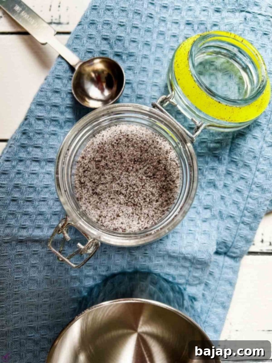 Preserving jar filled with a mix of granulated sugar and vanilla powder.