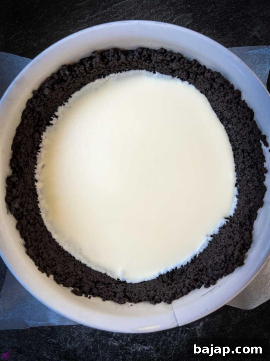 Cheesecake mixture poured into the Oreo crust. 