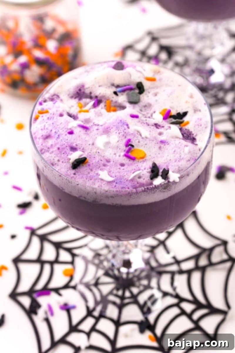 Witches Brew Punch, a 3-ingredient purple Halloween drink with rainbow sherbet for kids and adults.