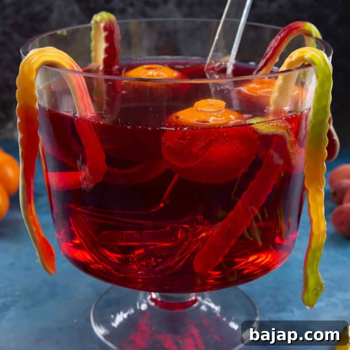 Simple red Halloween punch with floating decorations, ideal for a festive, kid-friendly celebration.