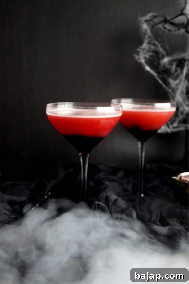 Vampire's Kiss Cocktail, a fun, spooky, and delicious red drink for Halloween parties.