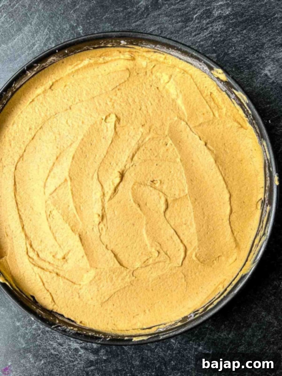 Spread the cheesecake filling on top of the cracker crumb crust.