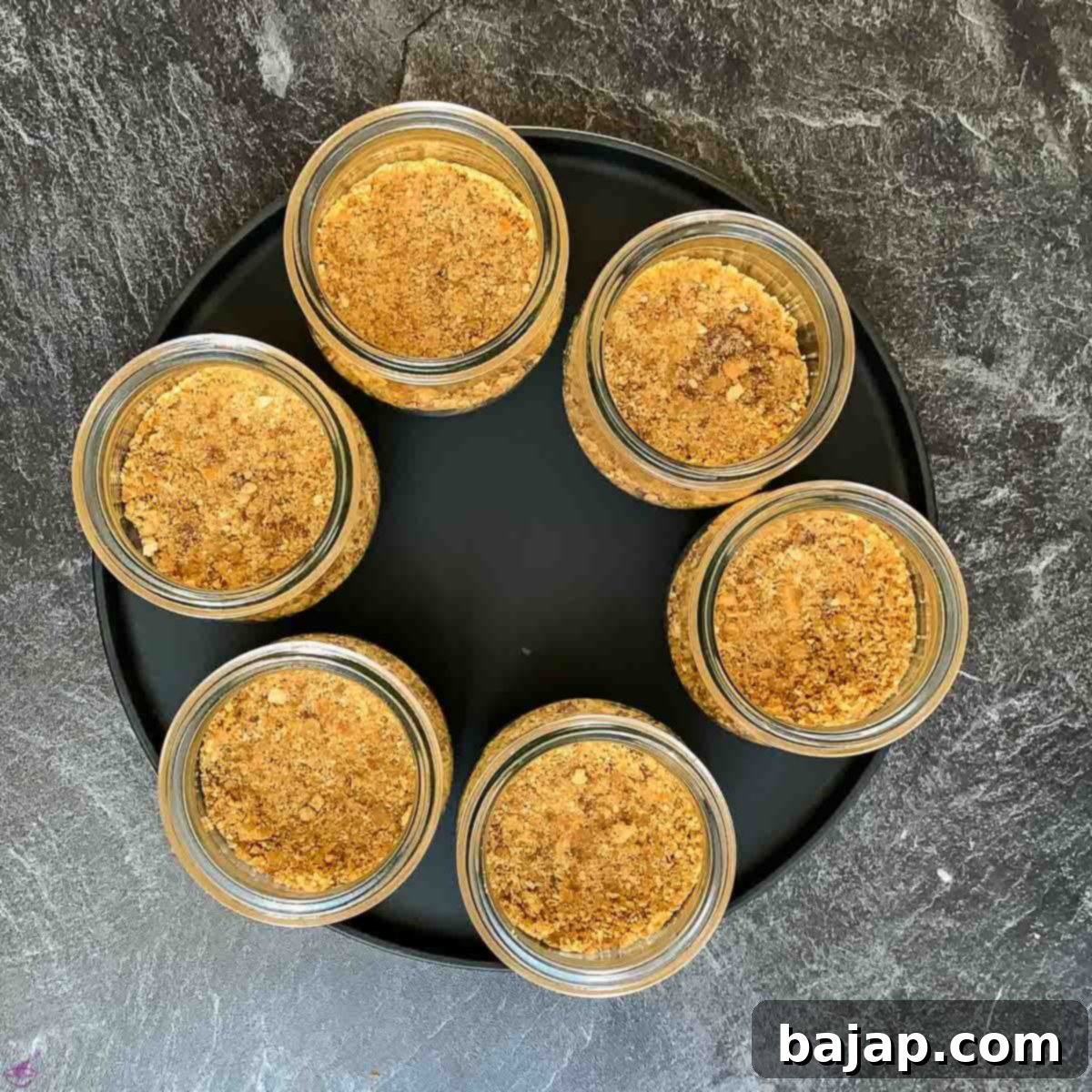 Press the graham cracker fig crumbs tightly inside the preserving jars.