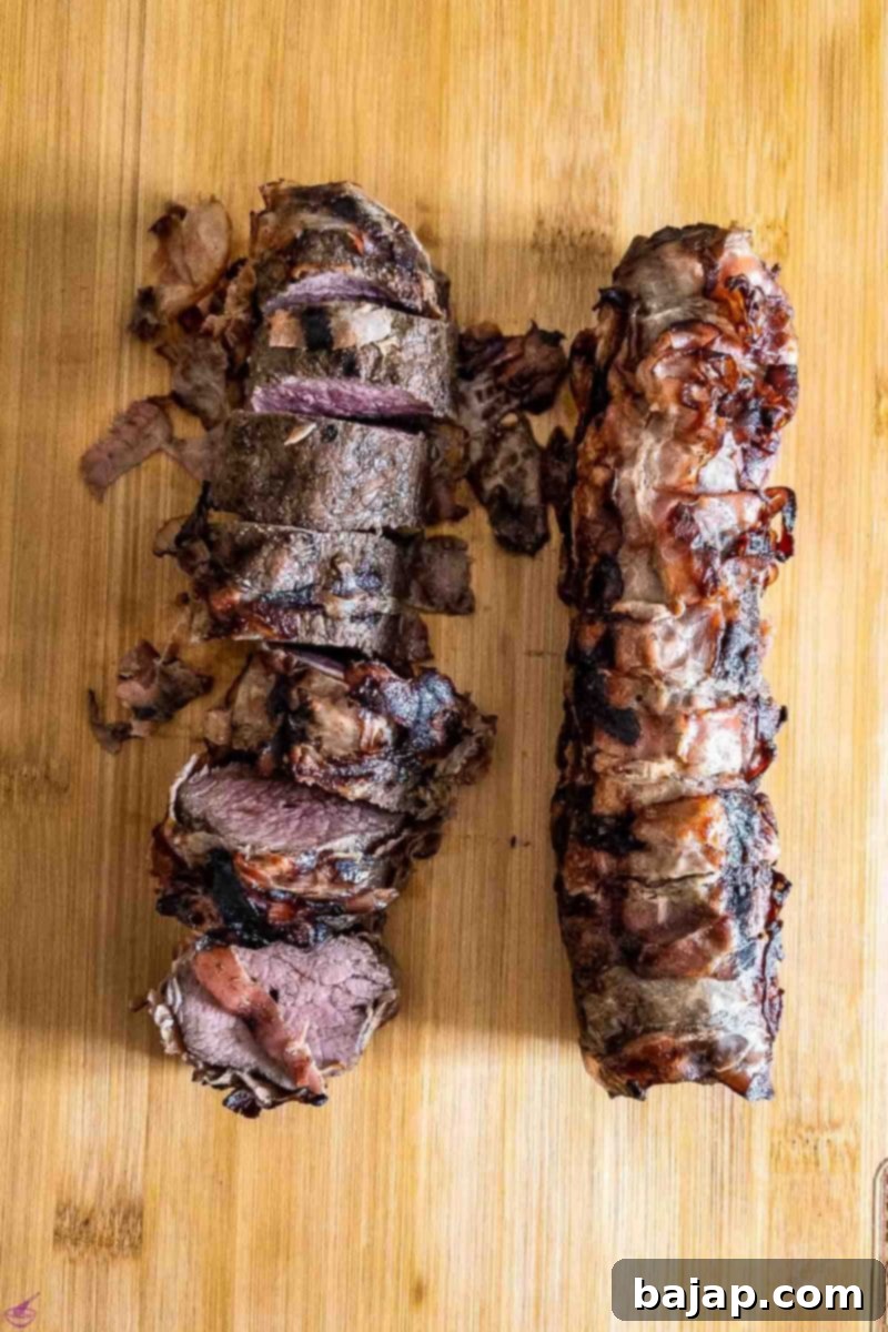Ready to serve bacon-wrapped venison loin.