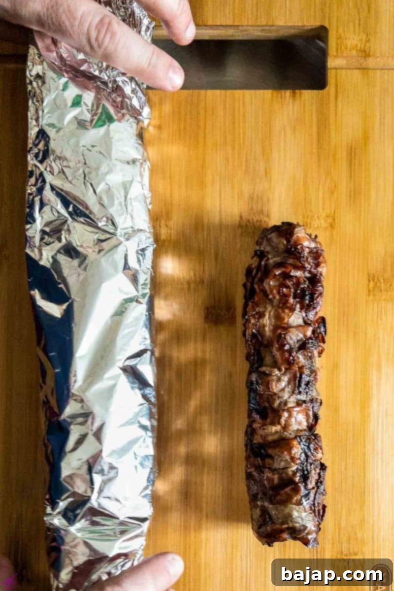 Hunter's Tenderloin Triumph 8 Unfolding the ready to serve bacon-wrapped venison loin.