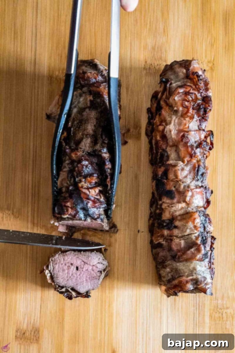 Ready to serve bacon-wrapped venison loin.